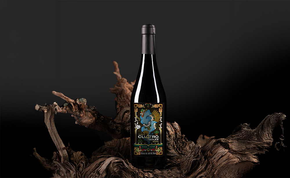 Wine bottle featuring Cuatro Soles campaign label – branding inspired by ancient Mexican lore